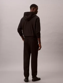 Calvin Klein Jogginghose aus Fleece mit Monogramm-Logoaufnäher^Herren Hosen & Shorts