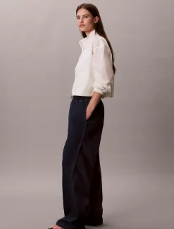 Calvin Klein Lässige Tech-Denim-Hose^Damen High Rise Skinny|Relaxed Boot