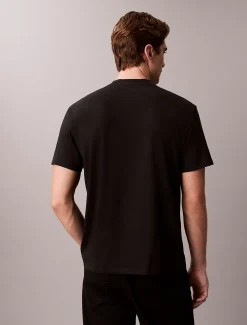 Calvin Klein Lässiges T-Shirt mit grafischem Varsity-Logo^Herren T-shirts